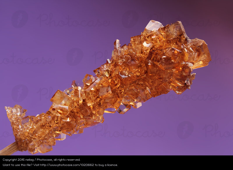 1320662-brown-sugar-crystals-on-wooden-stick-on-purple-background-photocase-stock-photo-large.jpeg.35e30880fa3fc3d1b96f9346e8eb776e.jpeg